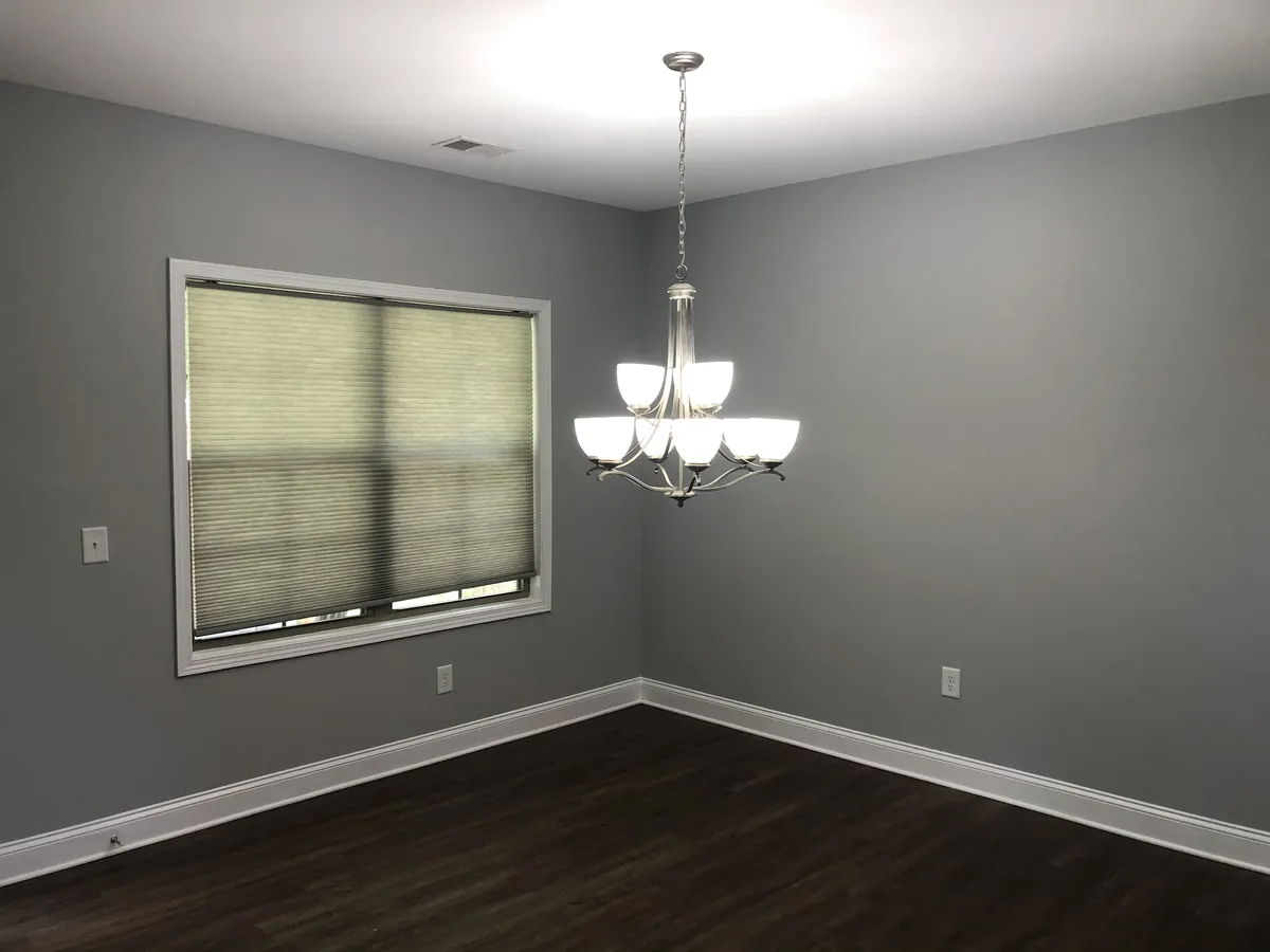 Dining room painted gray with white trim